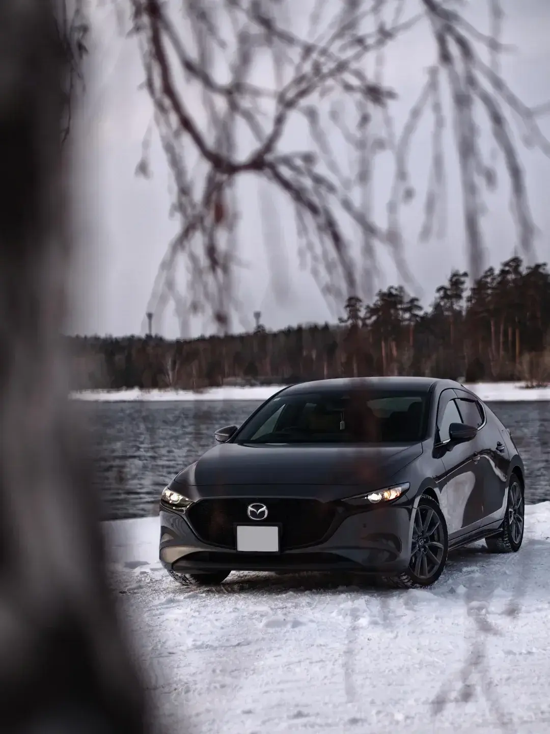 Used Mazda in winter landscape